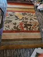 Full view of rug showing pattern and colors