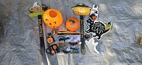 All Halloween décor items laid out on tarp