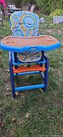 Front view of Evenflo highchair showing tray, seat pad, frame and footrest