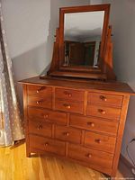 Front view of dresser showing drawers and attached mirror