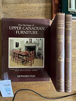 Front covers of the three books with clear titles and spines visible