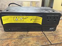 Front view of APC BE425M showing outlet layout and product label