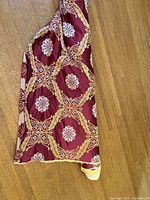 Full view of bolt displaying pattern and drape on floor