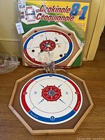 Board in crokinole configuration with accessories and box