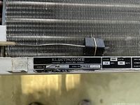 Data plate showing brand, model A60, serial 818222, 6000 BTU/h, 7.3 A, 980 W