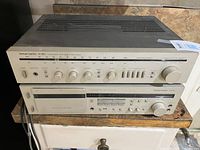 Front view of both Harman Kardon components stacked