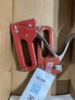 Two red Arrow heavy-duty staple guns in box