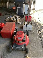 Full view of red PowerSmart push mower with handle extended