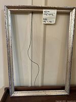 Silver-tone frame full view with hanging wire