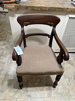 Front view of wooden Regency-style armchair