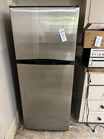 Front view of closed stainless Smod fridge