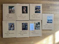 Front covers of all seven volumes laid out