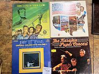 Front covers of four vinyl LP records