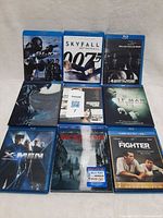 Nine Blu-ray cases laid out front cover visible