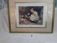 Full view of framed print on stand