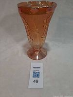 Full view of 9-inch marigold carnival glass vase