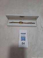 Watch in open Fiancée box with auction tag