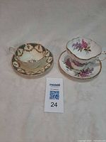 Both teacup sets grouped