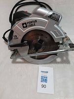 Full view of Porter Cable circular saw showing brand name, blade, handle and power cord