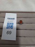 Ring on display pad with lot number card