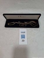 Entire necklace and earrings in presentation box