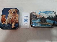 Both tins side by side for scale and comparison