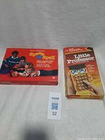 Speak & Spell box beside Little Professor boxed unit