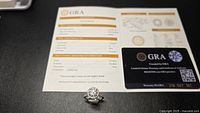 Ring with GRA paperwork and warranty card