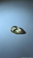 Pear cabochon golden citrine on neutral background