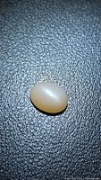 Top view of oval peach moonstone cabochon