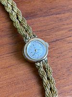 Front view of watch showing dial and bracelet