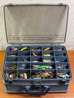 overall view of tackle box open showing compartments filled with lures