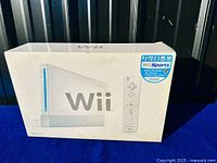Front of Nintendo Wii Sports bundle box showing console and remote