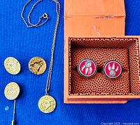 Overview showing Raptors cufflinks in box and Blue Jays jewelry set