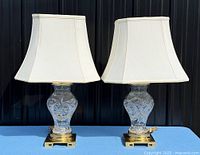 Front view of both matching crystal table lamps with shades attached