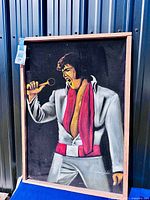 Full view of framed velvet painting showing Elvis figure and frame