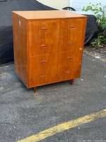 Front view showing dresser, four drawers, teak veneer, recessed pulls