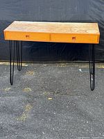 Front view of desk showing drawers and legs