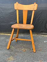 Front view of pine chair showing seat, legs and backrest