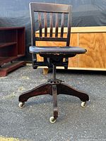 Full view of chair showing backrest, seat, base, casters