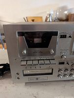 Front close-up of Sears stereo receiver cassette section and controls