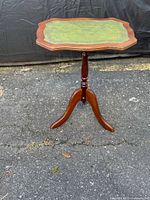 Full view of mahogany side table showing pedestal and legs