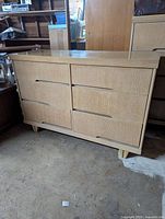 Front view of white oak six-drawer dresser