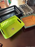 All four baskets grouped together showing different materials and colors