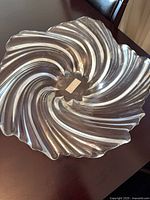 Top view of clear glass swirl bowl on table