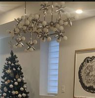 Chandelier installed showing design and globes