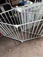 Panels of white aluminum pet exercise pen connected together