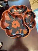 Top view showing three compartments and floral carving