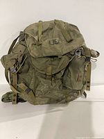 Front view of ALICE pack showing flap, straps, US marking