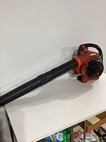 Full view of Echo PB-251 blower with tube attached